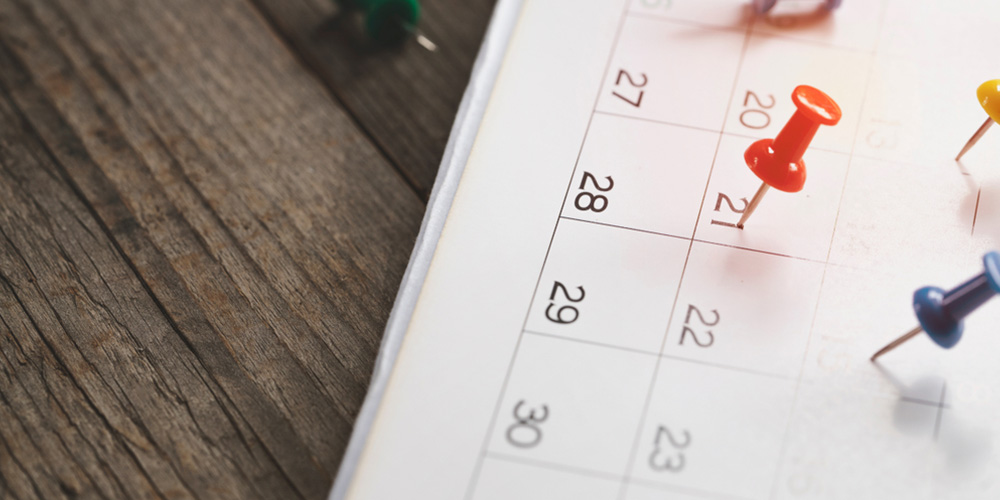 close up of calendar on the table, planning for business meeting or travel planning concept