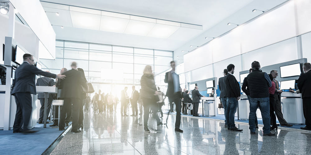 tradeshow visitors at trade fair stands