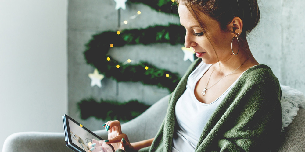 woman looking at her tablet