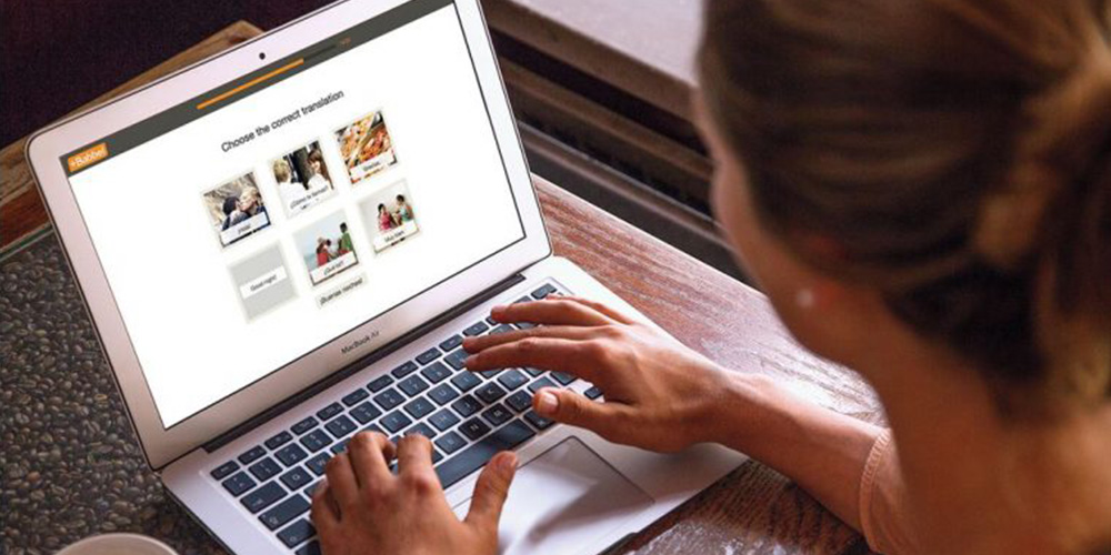 woman viewing the Babbel site on her laptop